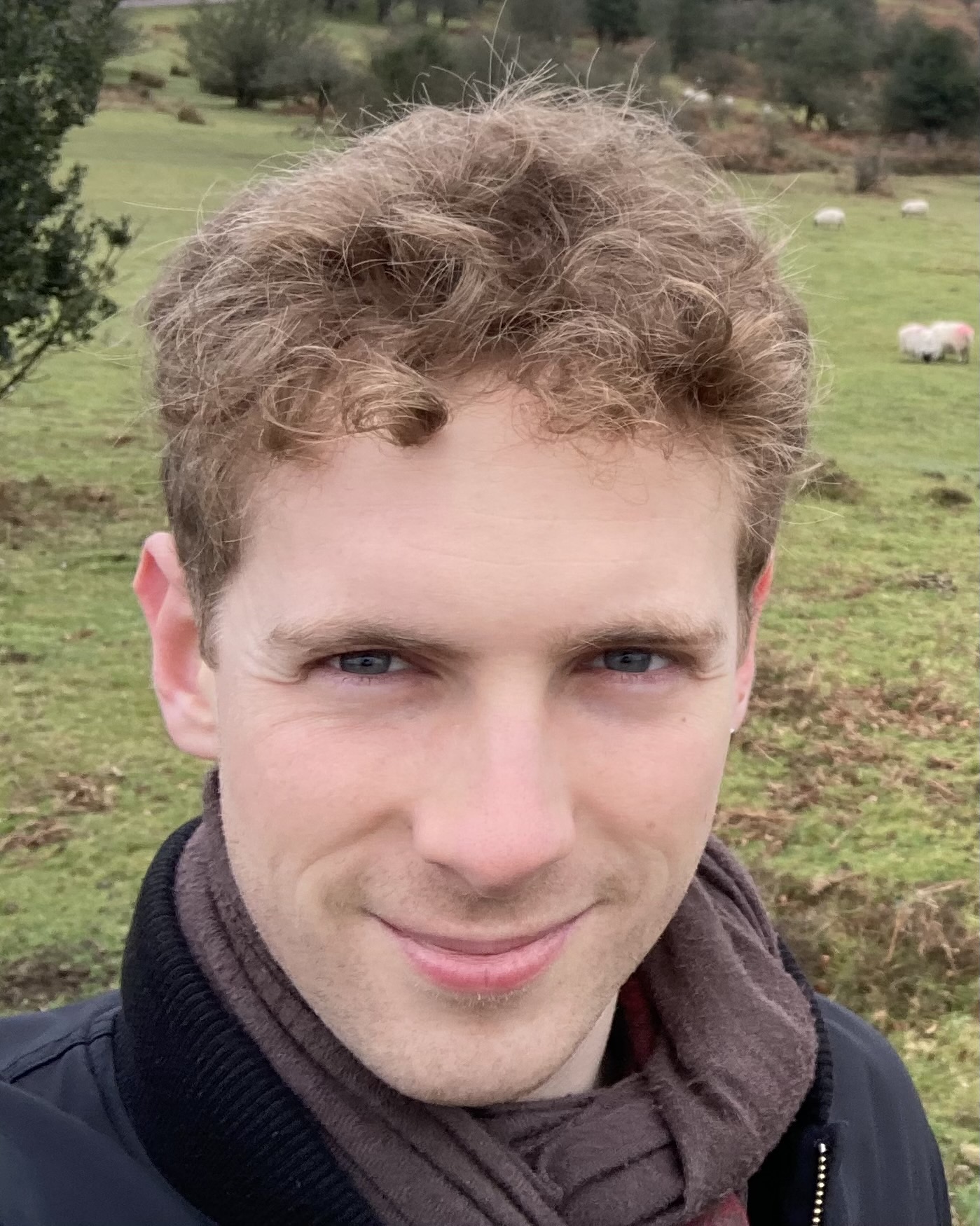 Profile picture of Ed Parr - a white man in his twenties with short curly brown hair 